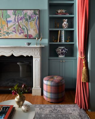 A living room corner with an aqua blue color