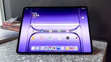 OnePlus Pad 3 on granite worktop, on home screen
