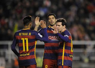 Lionel Messi of FC Barcelona celebrates with Neymar and Luis Suarez after scoring his 2nd goal during the La Liga match between Rayo Vallecano and FC Barcelona at Estadio de Vallecas on March 3, 2016 in Madrid, Spain.