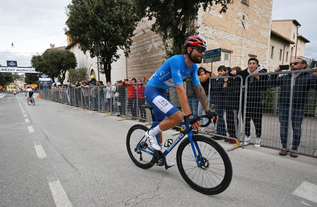 Ganna rolls in on a neutral service bike