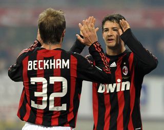 AC Milan's Brazilian forward Pato (R) celebrates with teammate English midfielder David Beckham after scoring against Fioentina during their Italian Serie A match on January 17, 2009 at San Siro Stadium in Milan. AFP PHOTO / DAMIEN MEYER (Photo credit should read DAMIEN MEYER/AFP via Getty Images)