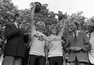 Tour de France winners Frenchman Laurent Fignon and Marianne Martin of the United States smile on the podium on July 22 1984 in Paris