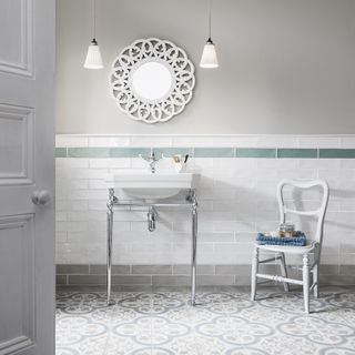 pastel coloured bathroom with decorative floor tiles