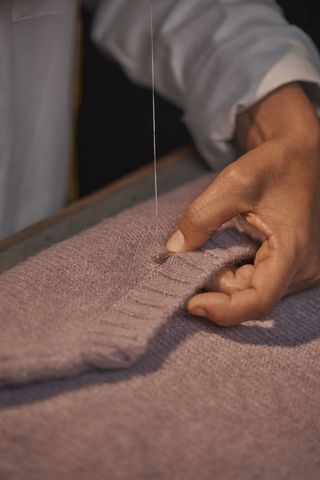 Herno knitwear being produced in factory