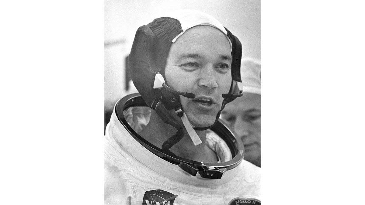 Astronaut Michael Collins wears his spacesuit during a final communications system check before boarding the Apollo 11 mission, on July 16, 1969.