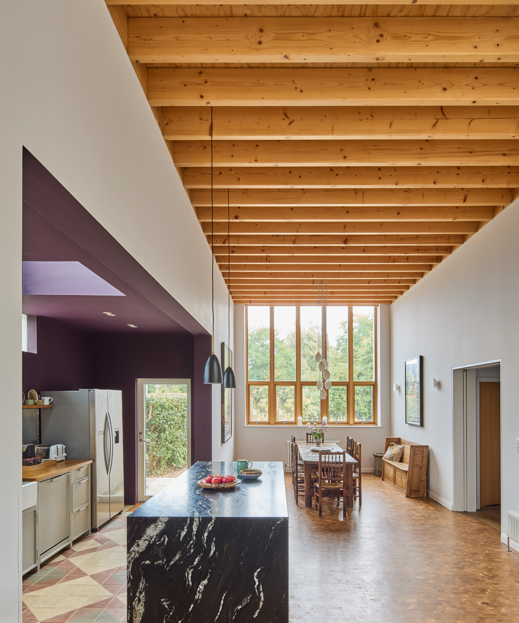 Open plan kitchen diner with wooden beam ceiling