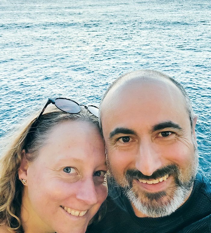 Alison Wainwright with Helder, in a selfie smiling by the sea