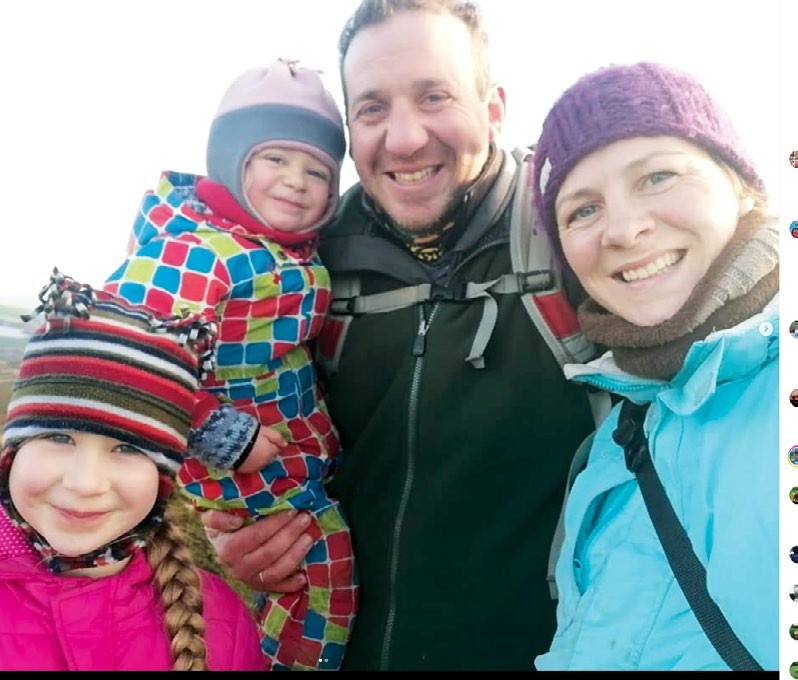 Charis and Matthew Watkinson with their children Elsa and Billy, smiling in coats and woolly hats