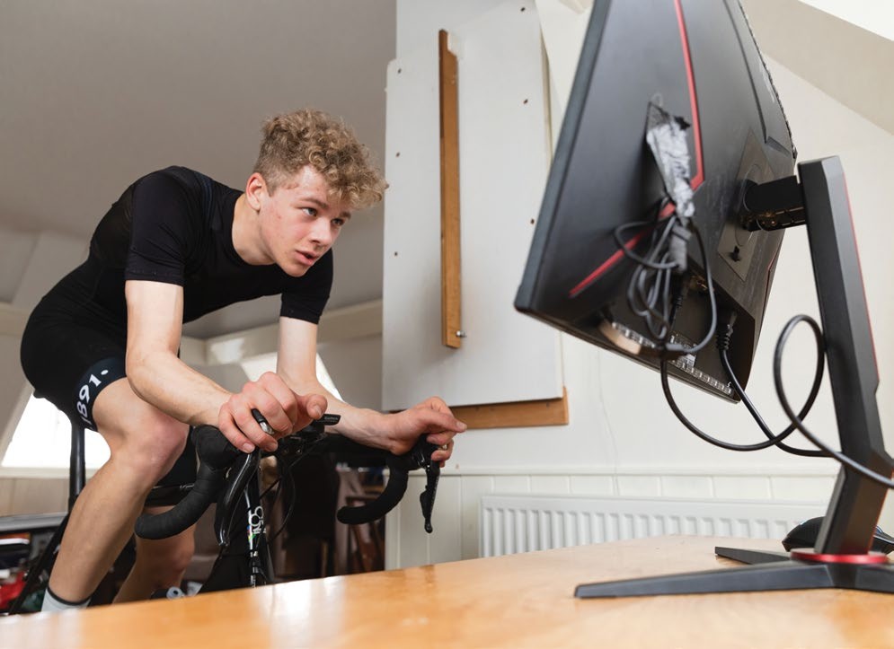 Joe Baker riding on a trainer indoors