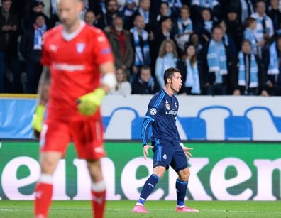 Real Madrid's Portuguese forward Cristiano Ronaldo celebrates after scoring the opening goal during the UEFA Champions League first-leg Group A football match between Malmo FF and Real Madrid CF at the Swedbank Stadion, in Malmo, Sweden on September 30, 2015. AFP PHOTO / JONATHAN NACKSTRAND (Photo credit should read JONATHAN NACKSTRAND/AFP via Getty Images)