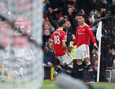 MANCHESTER, ENGLAND - DECEMBER 02: Cristiano Ronaldo of Manchester United celebrates after scoring their side's second goal during the Premier League match between Manchester United and Arsenal at Old Trafford on December 02, 2021 in Manchester, England. (Photo by Alex Livesey/Getty Images)