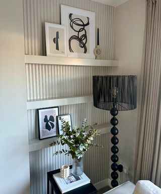 A living room alcove with a reeded design and three IKEA MOSSLAND picture ledges