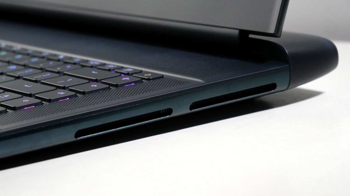 Alienware 16 Area-51 (RTX 5080) open on a white desk, highlighting the vents on the right.
