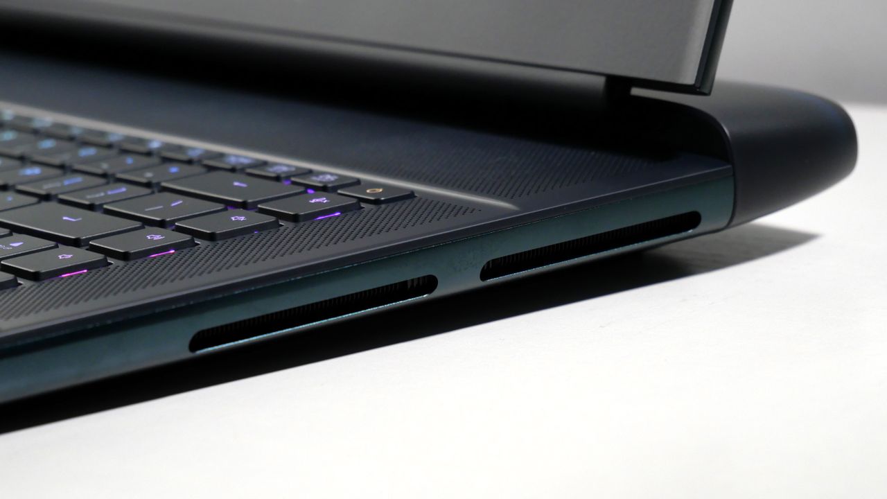 Alienware 16 Area-51 (RTX 5080) open on a white desk, highlighting the vents on the right.
