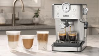 De'Longhi Linea Classic espresso machine on kitchen counter with hot and cold coffee drinks