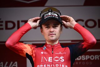 A serious looking Tom Pidcock (Ineos Grenadiers) on the podium after winning Strade Bianche