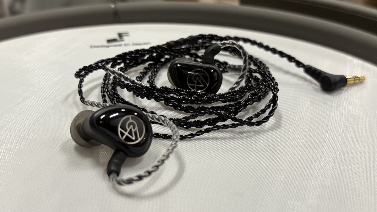 64 Audio Aspire 4 in-ears sat on an electronic snare drum pad
