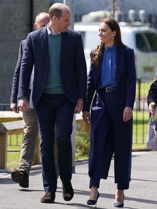 Prince William, Duke of Cambridge and Catherine, Duchess of Cambridge meet members of the public during a visit to the Wheatley Group