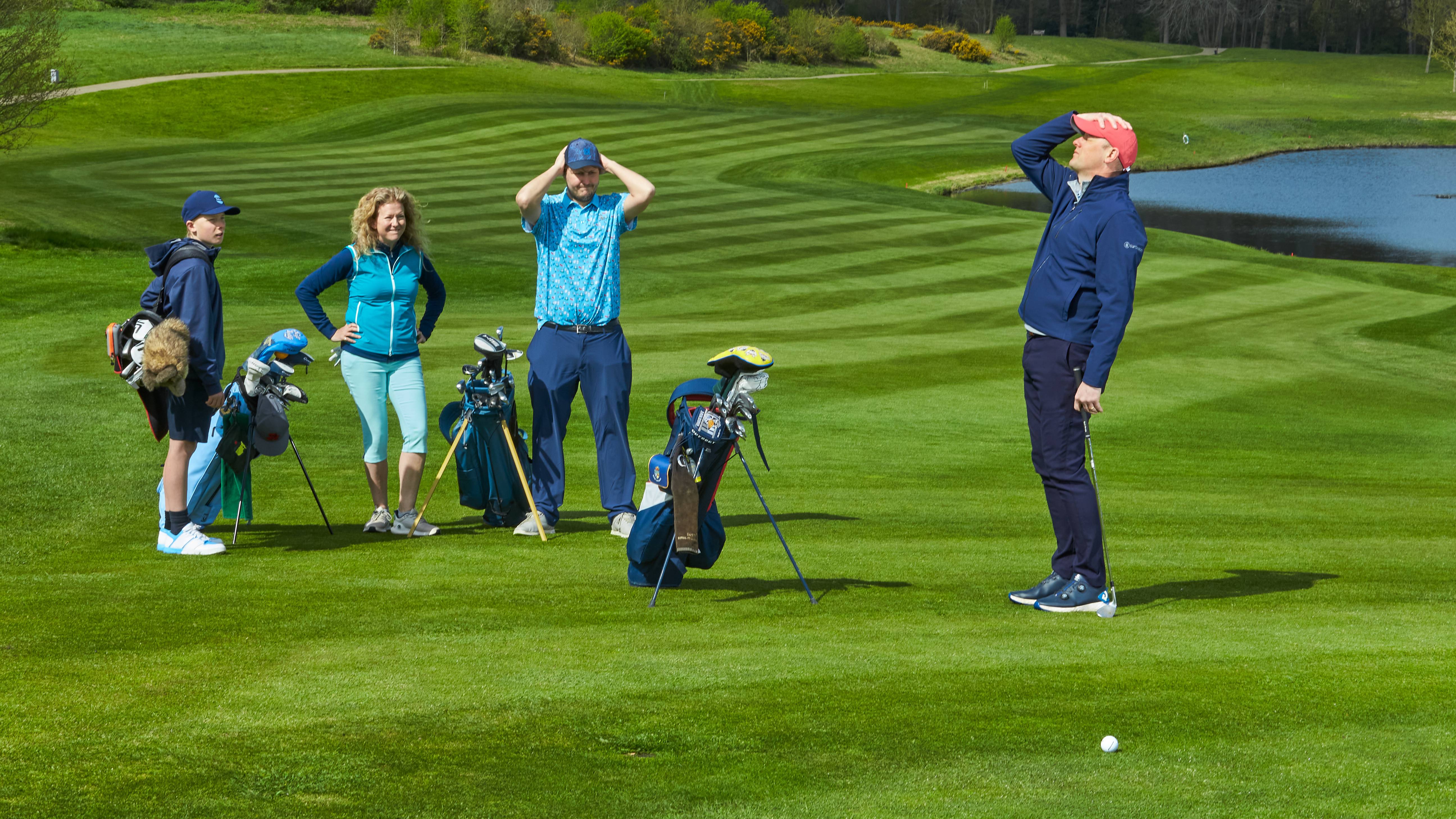 Golfer frustrated after hitting a bad shot