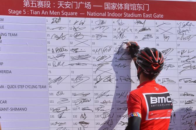 Philippe Gilbert is one of the last to sign his name on the board