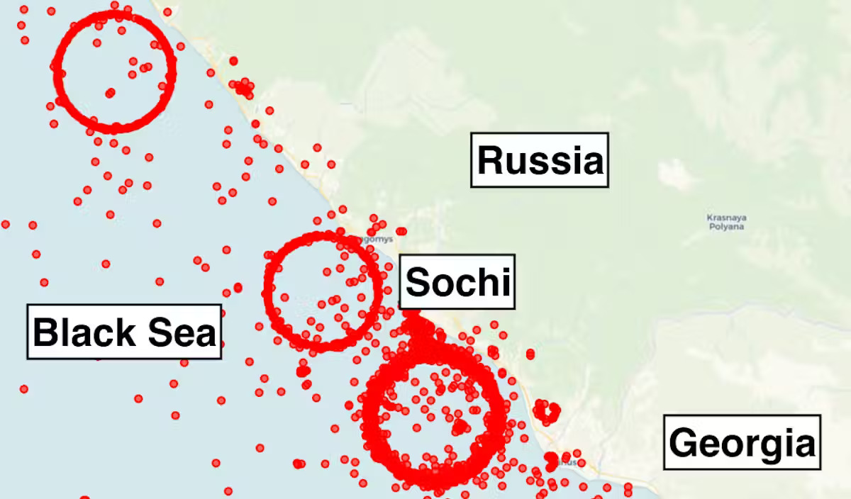 A map showing the coastline of Russia with labeled areas for Sochi, Georgia and the Black sea. A series of red dots and circles are put along the sea and coastline.