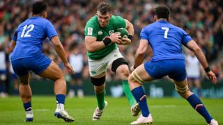 Peter O'Mahony of Ireland (C) runs into two France players
