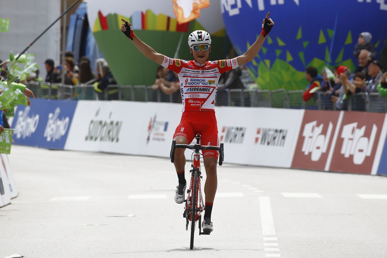 Fausto Masnada sits up and celebrates
