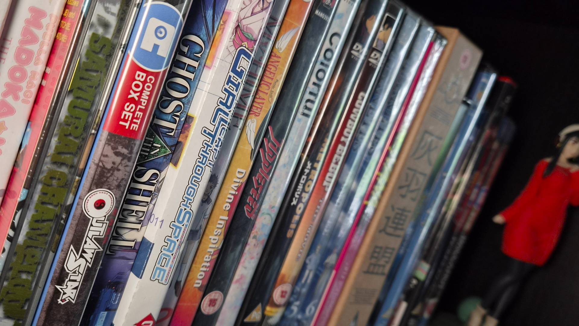 Photo of a shelf full of anime DVDs and Blu-rays.