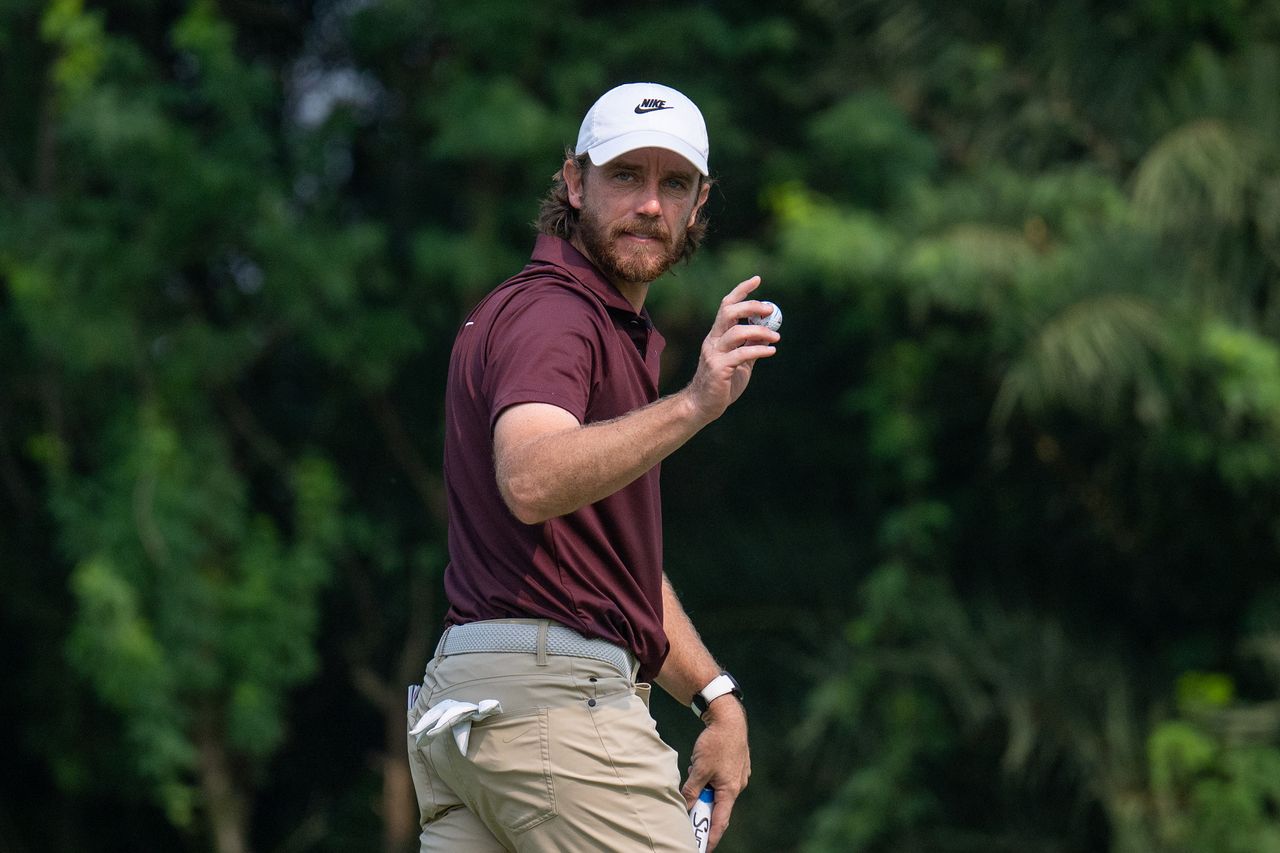 Tommy Fleetwood waves to the crowd