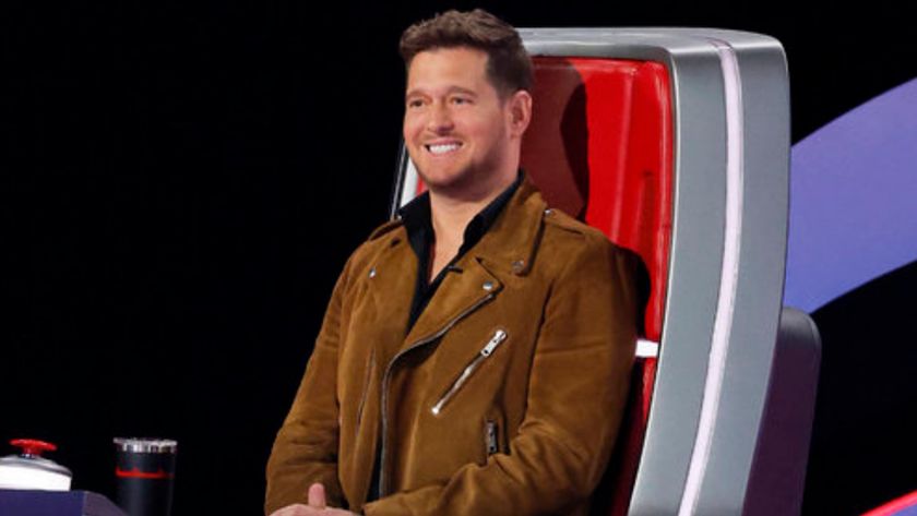 Michael Buble smiles as he listens to a Blind Audition on The Voice Season 28.