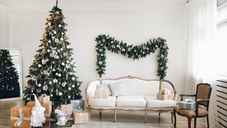 White living room with Christmas tree decorating idea with draped lights to create an icicle feel