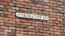 Sign from the Coronation Street set on a brick wall