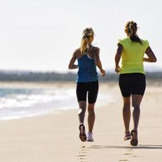 Woman jogging on beach