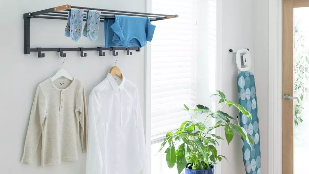 Wall mounted clothes airer drying clothes