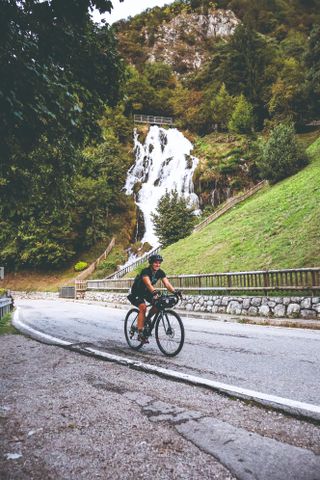 Image of Emma Magnus riding up a climb