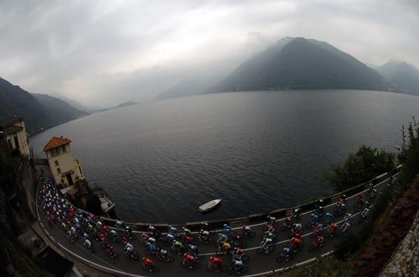The peloton rolls along the shore of Lake Como.