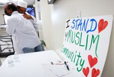 Muslims embrace following Friday prayers at the Islamic Center of New Mexico on August 12, 2022