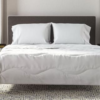 Lightweight Comforter on a bed.