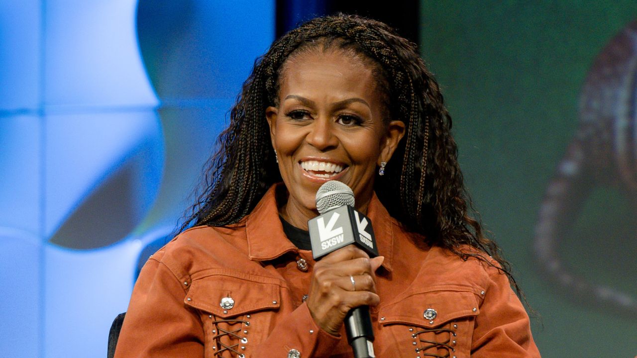 Michelle Obama onstage at south by southwest with a crown braid