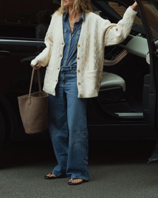 woman in relaxed jeans and cardigan