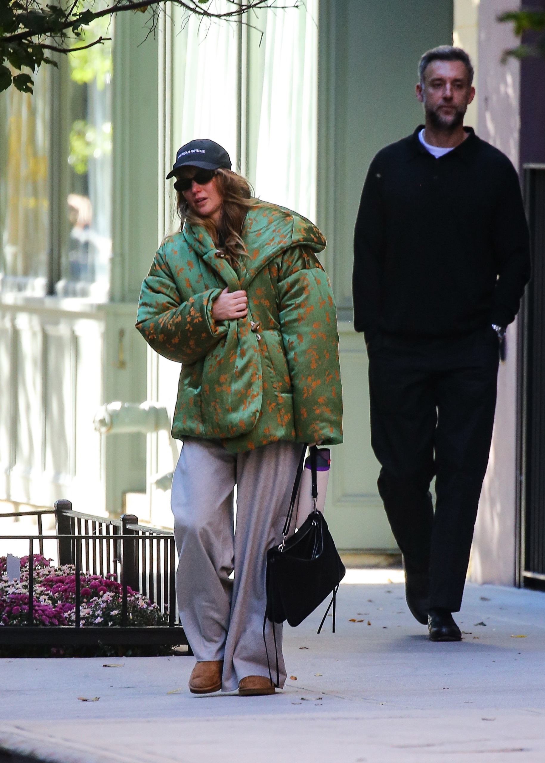 Jennifer Lawrence wore a Dries Van Noten puffer jacket with The Row pants, a Phoebe Philo bag, and Ugg boots