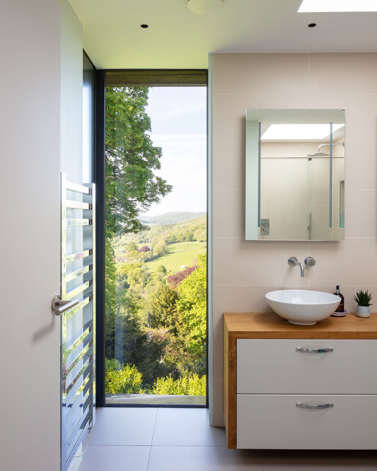 modern bathroom vanity unit with tall picture window