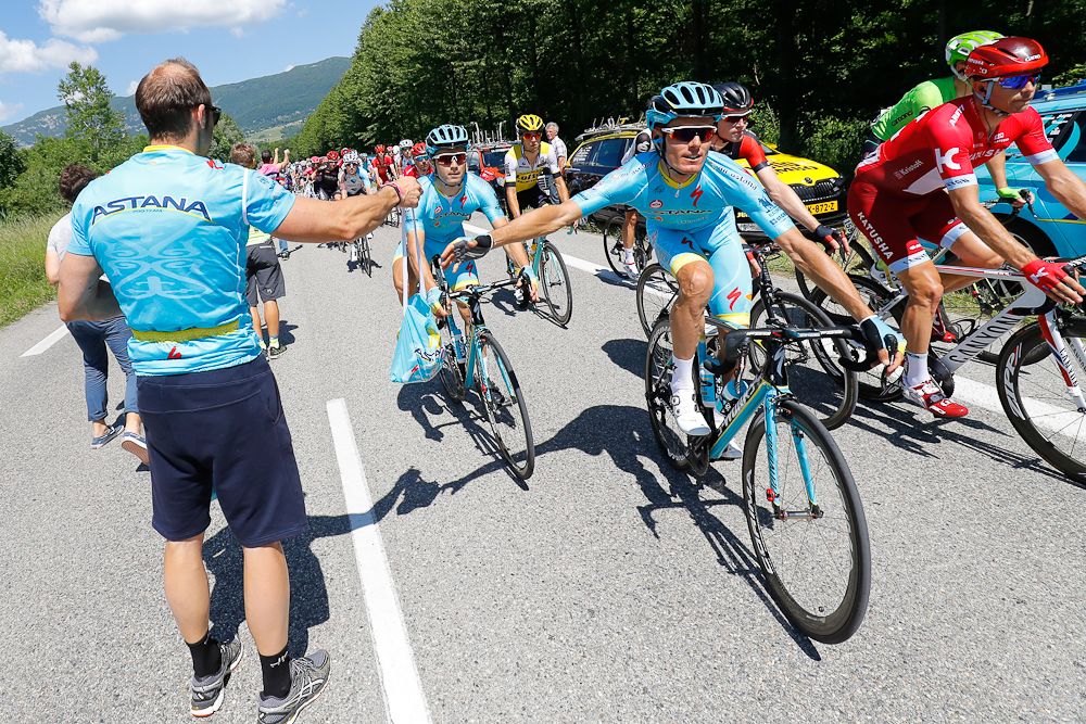 Luis Leon Sanchez grabs some refreshments in the feed zone