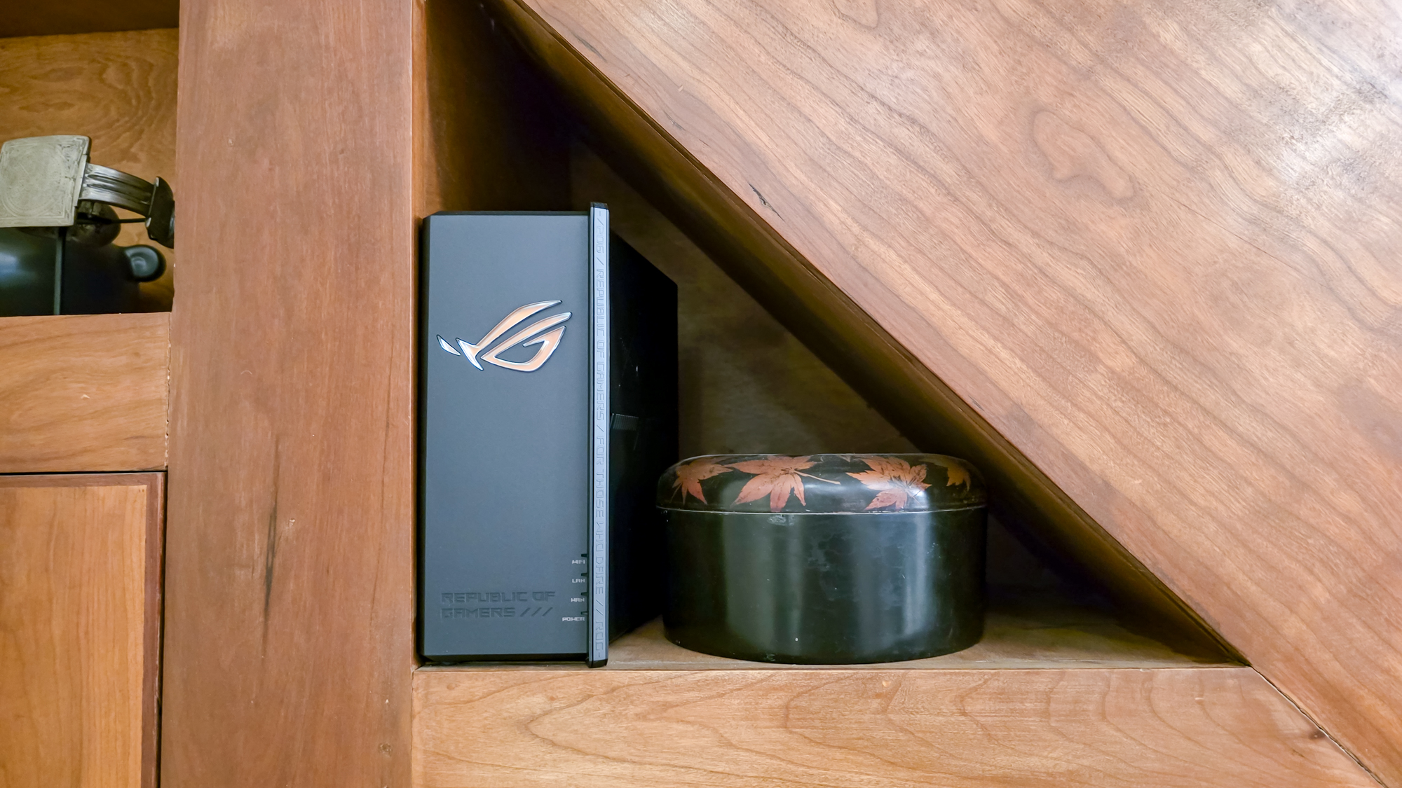 Asus ROG Strix GS-BE18000 gaming router on a shelf