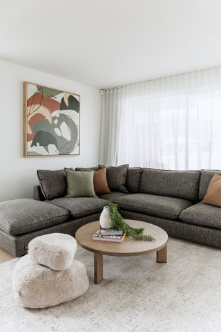 A living room with colored throw cushions