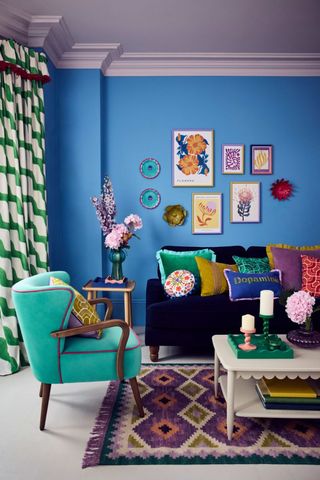 blue living room with patterned rug and curtains