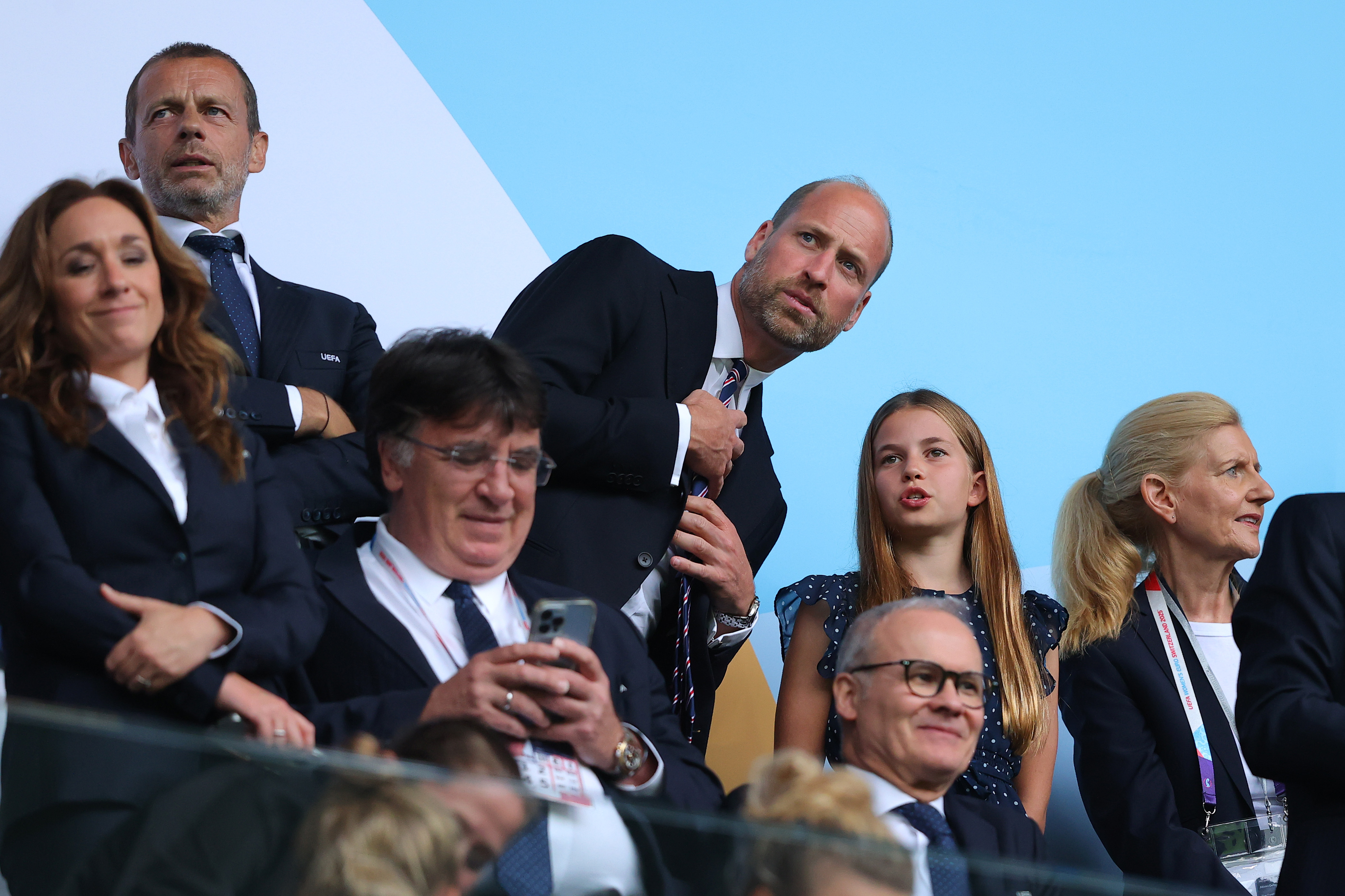 Prince William wears a suit and watches the Lionesses play against Spain alongside daughter Princess Charlotte