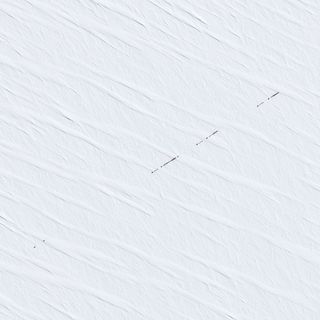 A French satellite captured this shot of a resupply convoy headed to Earth's remotest research station, Concordia in Antarctica. 