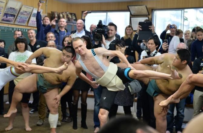 Chris Froome limbers up for the wrestling