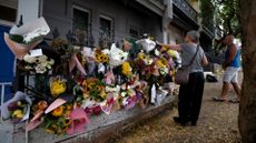 Floral tributes left by mourners are seen outside the shared residence of entertainment journalist Jesse Baird in the Sydney suburb of Paddington on 27 February 2024